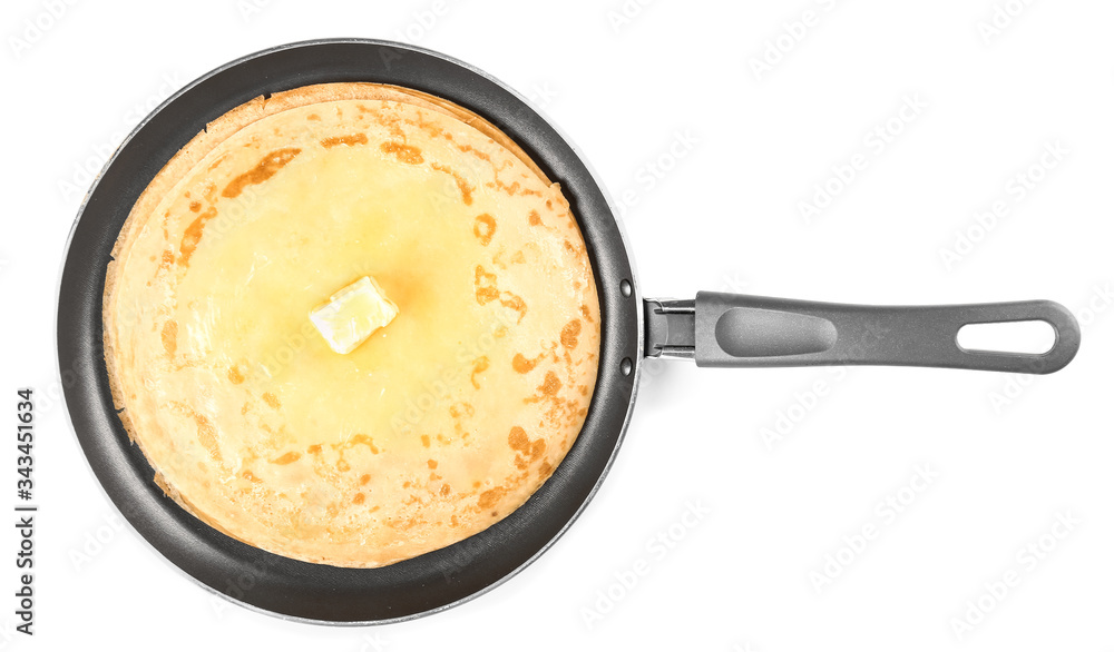 Frying pan with tasty blini on white background