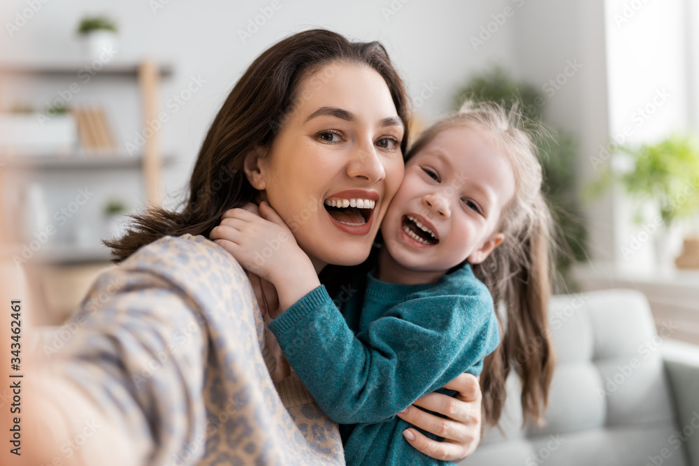 mom and child are having fun at home