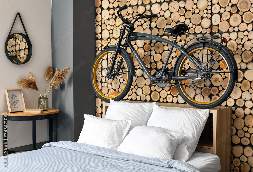 Interior of modern bedroom with bicycle