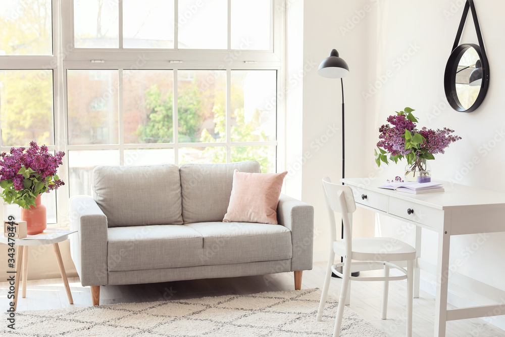 Interior of living room with spring flowers