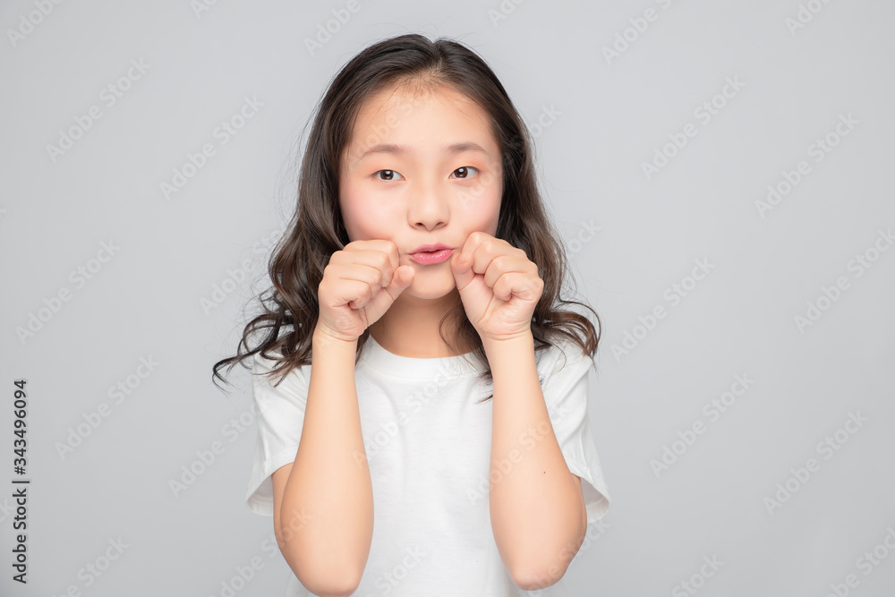 Asian primary school girls in gray background