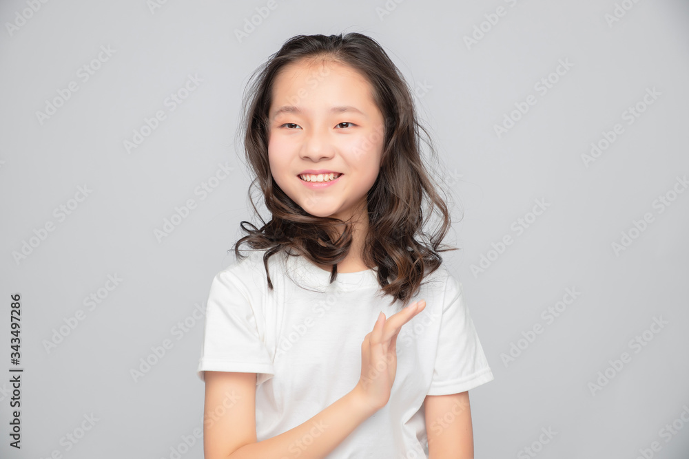 Asian primary school girls in gray background