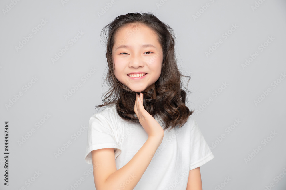 Asian primary school girls in gray background