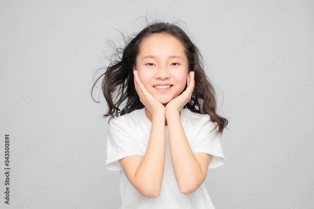 Asian primary school girls in gray background