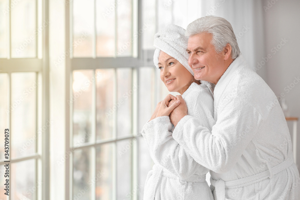 Morning of mature couple in bathroom