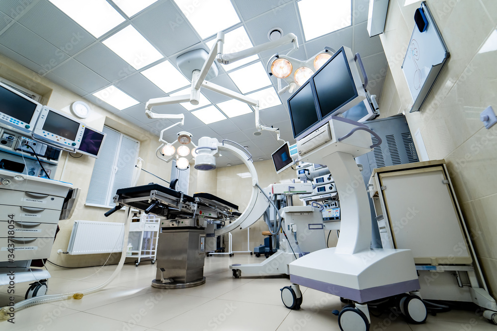 Surgical room in hospital with robotic technology equipment, machine arm surgeon in futuristic opera