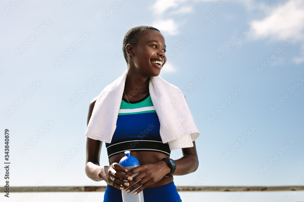 Sportswoman taking break after workout session