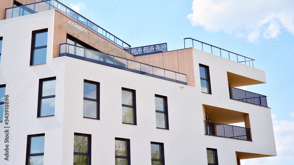 Contemporary residential building exterior in the daylight. Modern apartment buildings on a sunny da