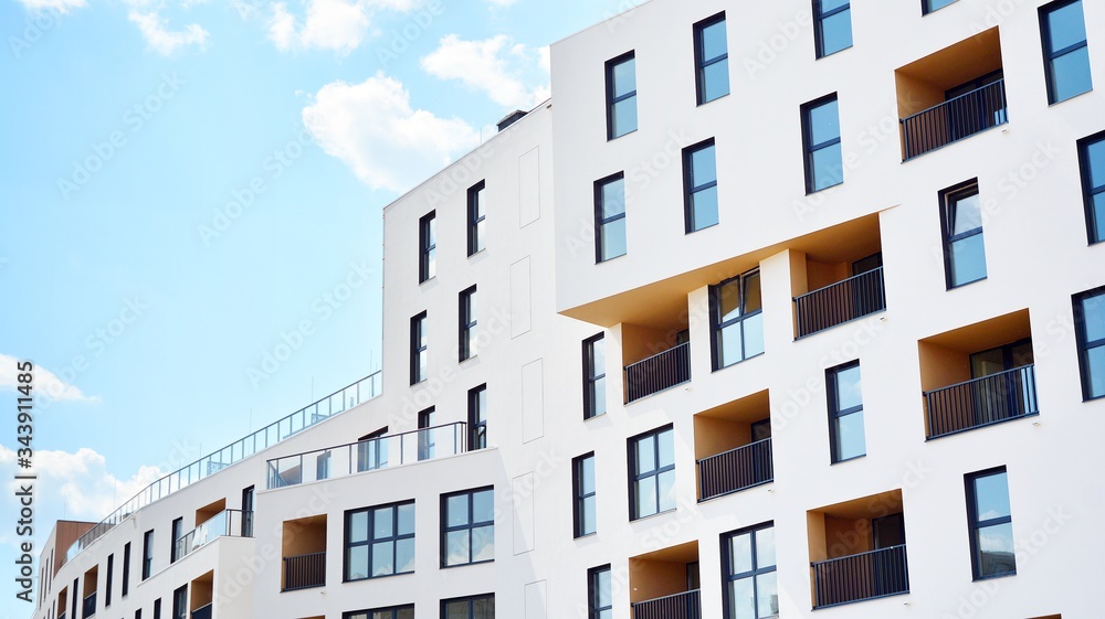 Contemporary residential building exterior in the daylight. Modern apartment buildings on a sunny da