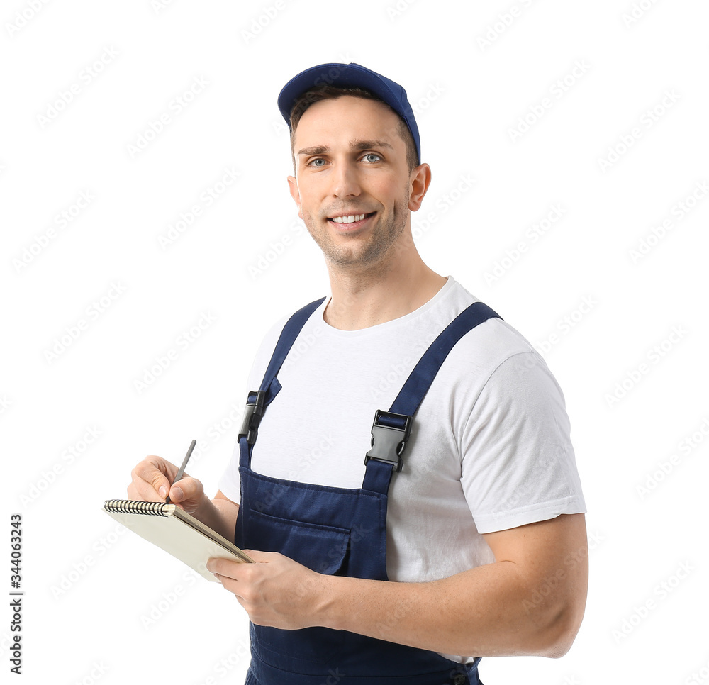 Male truck driver with notebook on white background