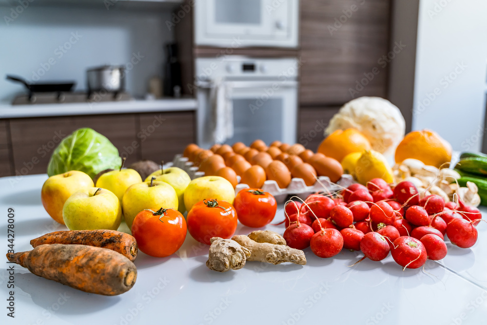 Various paleo diet products on white table. Top view. Healthy dieting. Fresh tasty vegetables, fruit