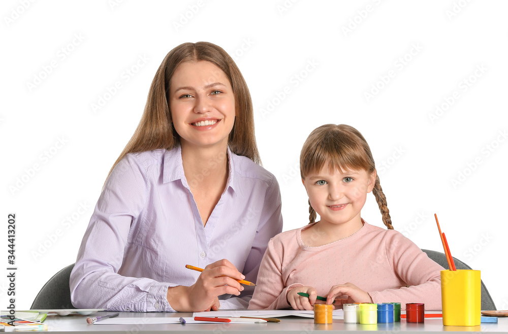 Drawing teacher giving private art lessons to little girl on white background