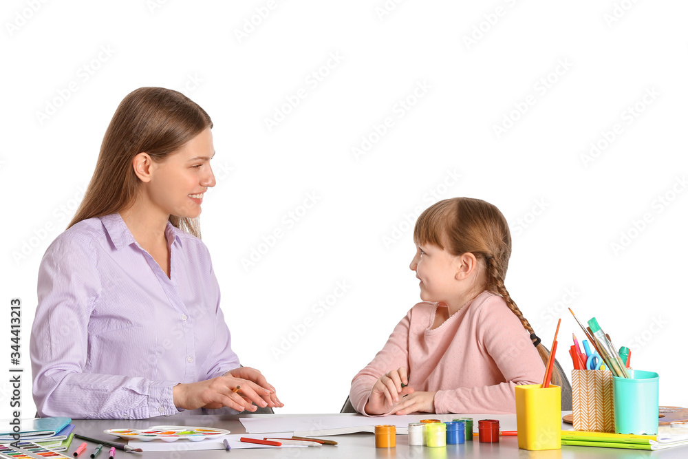 Drawing teacher giving private art lessons to little girl on white background