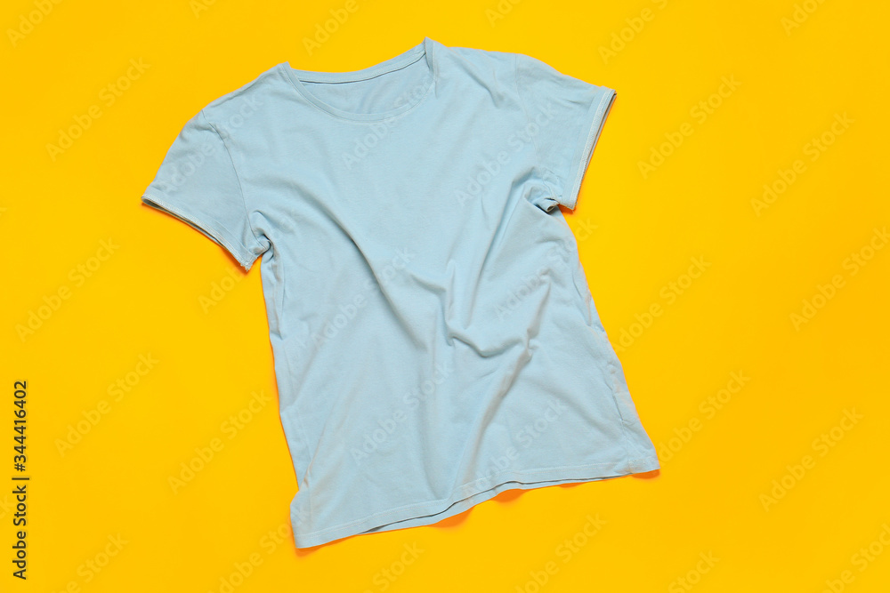 Stylish t-shirt on color background