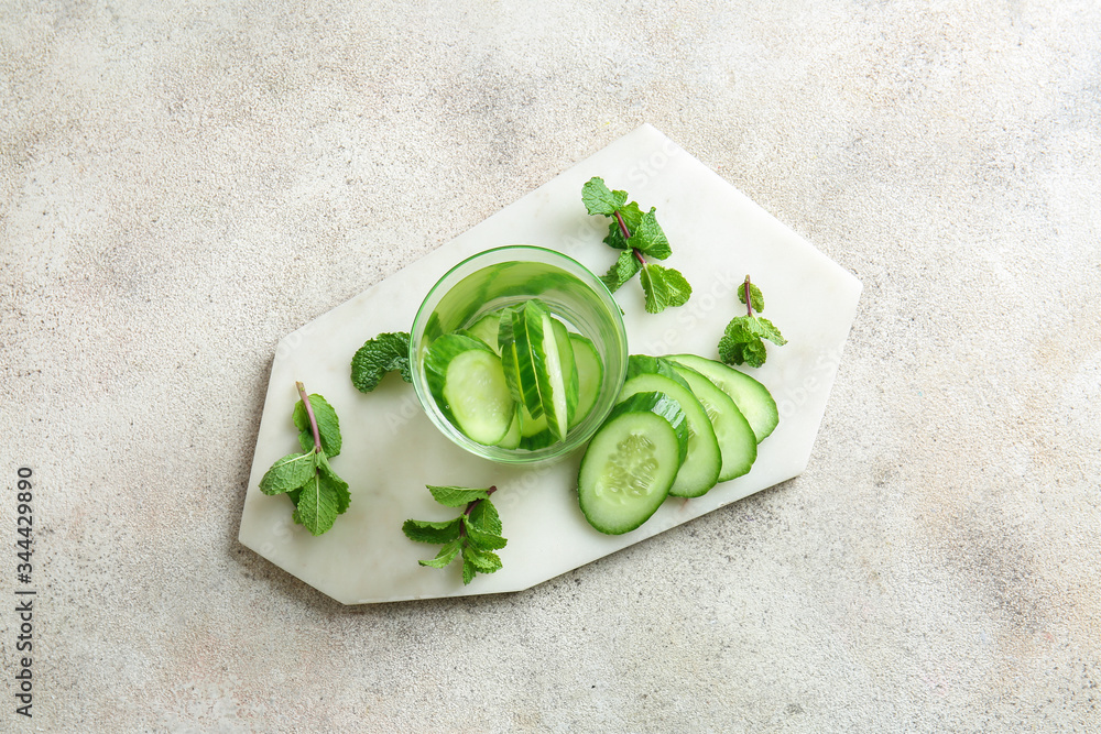 Glass of cucumber infused water on table