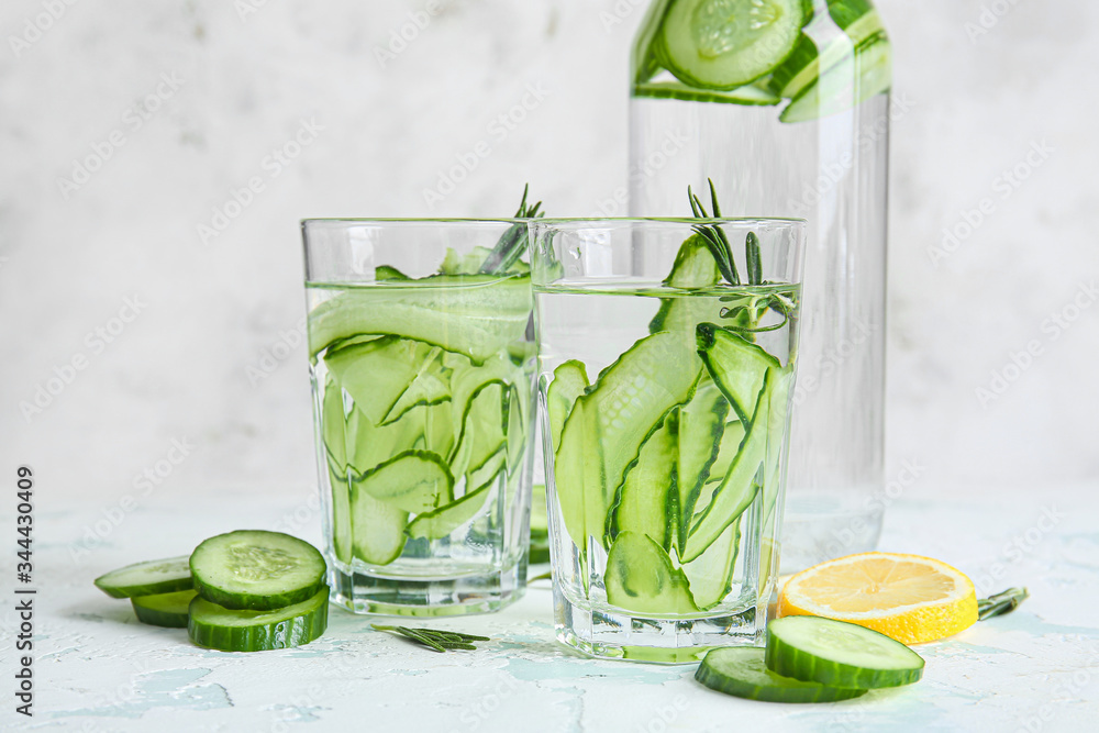 Glassware of cucumber infused water on table