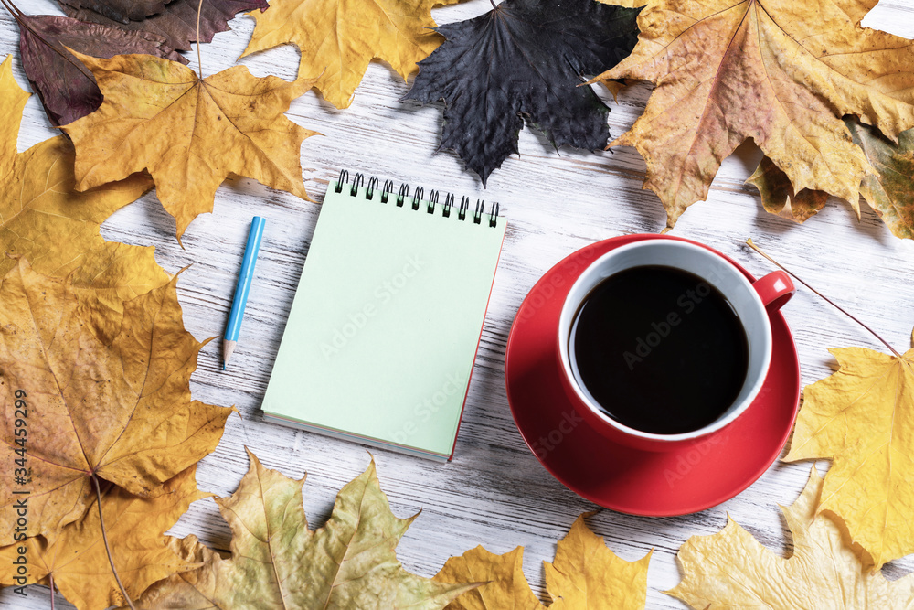 Flat lay autumn composition with cup of black tea