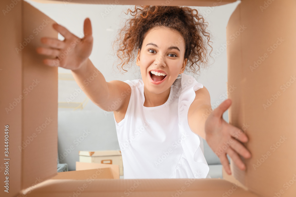 Happy woman with open box, view from inside