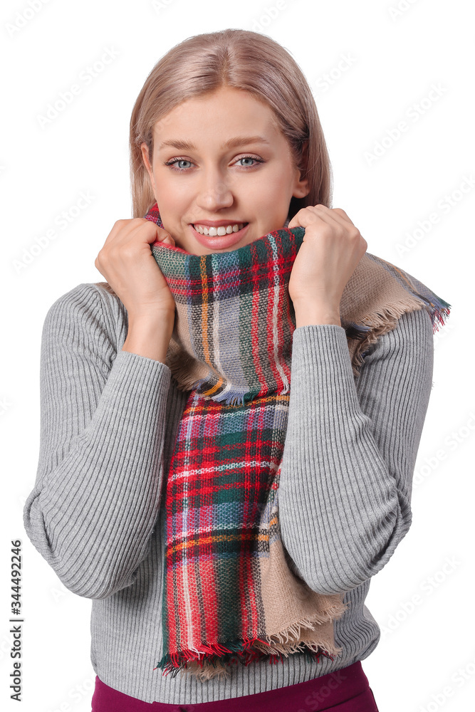 Beautiful young woman with stylish scarf on white background