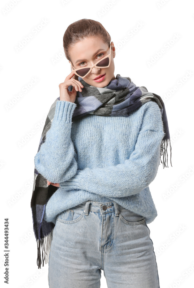 Beautiful young woman with stylish scarf on white background