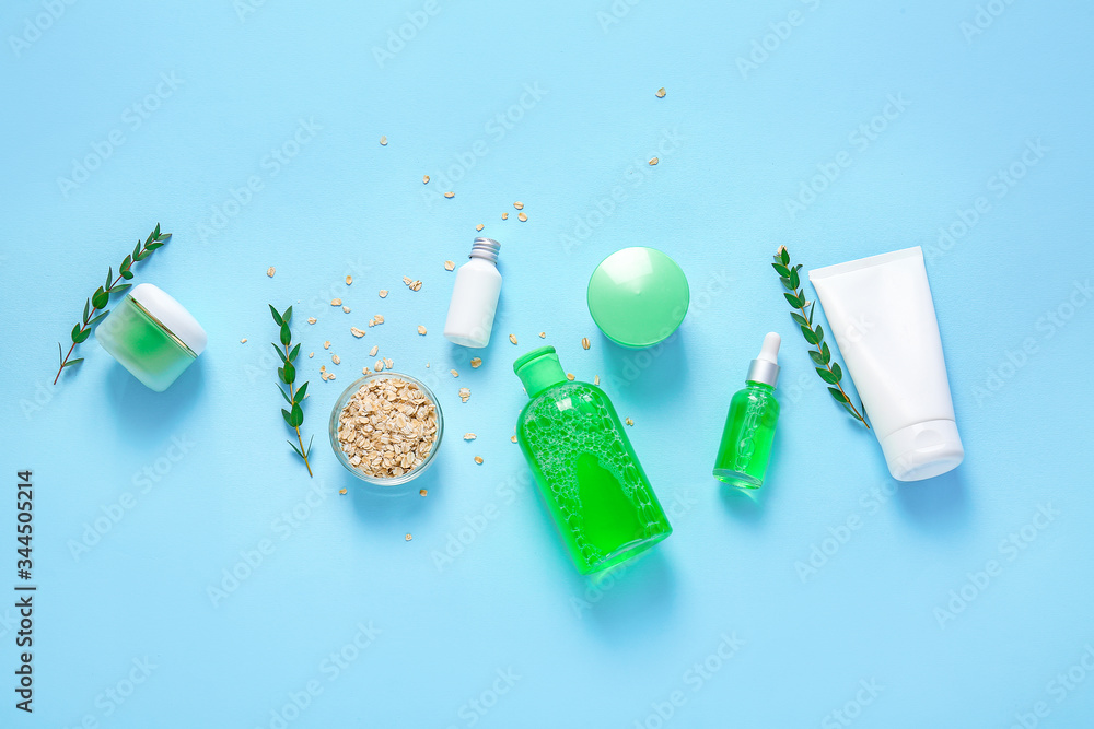 Natural cosmetics with ingredients on color background