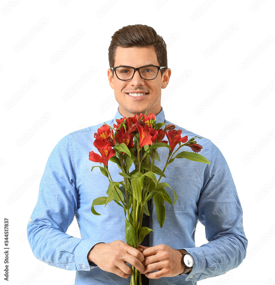 Handsome man with bouquet of flowers on white background