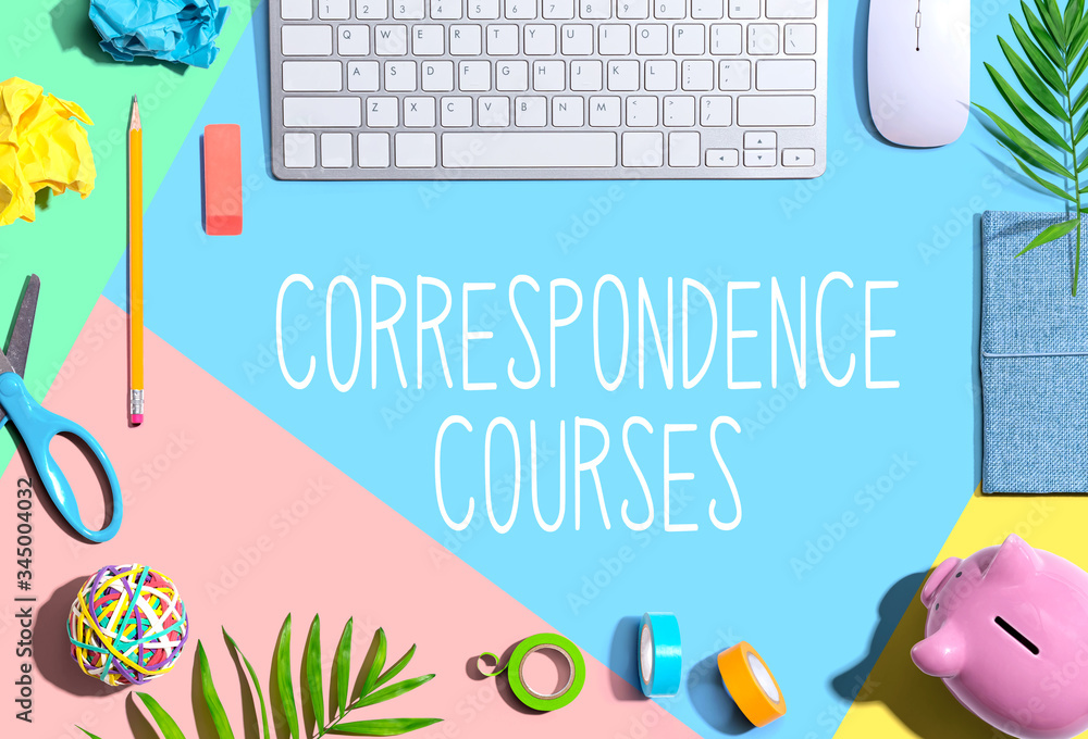 Correspondence courses with office supplies and a computer keyboard