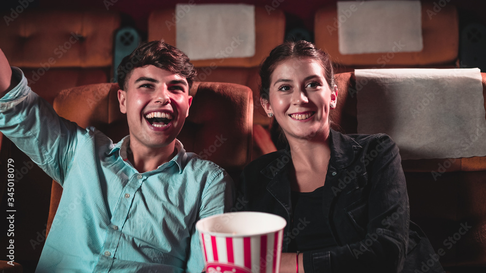 People audience watching movie in the movie theater cinema. Group recreation activity and entertainm