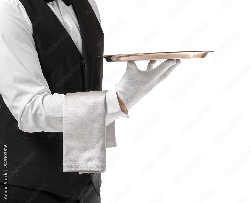 Handsome male waiter with empty tray on white background