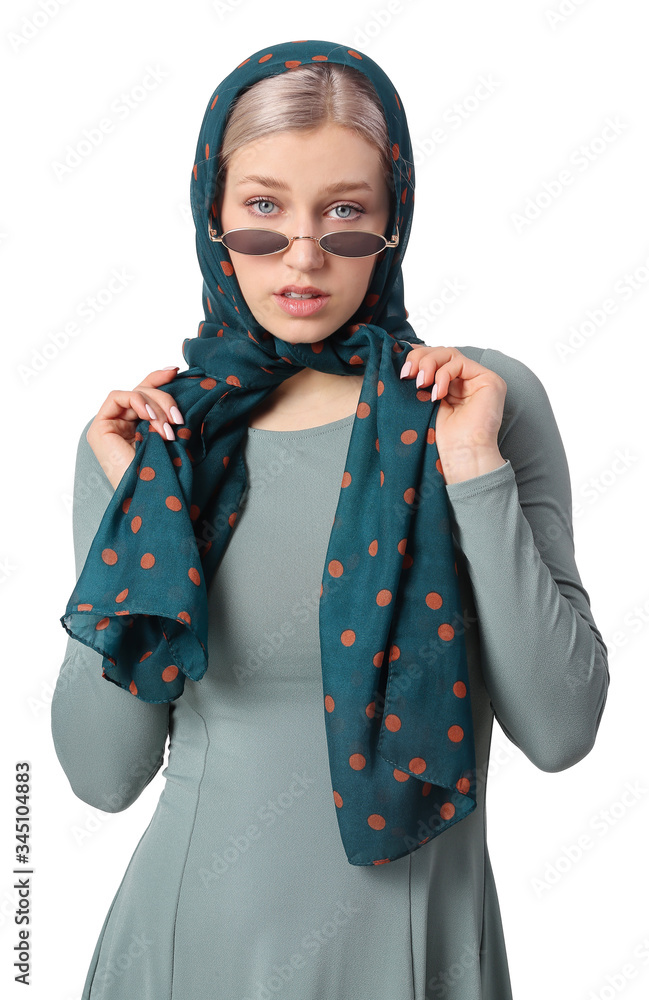 Beautiful young woman with stylish scarf on white background