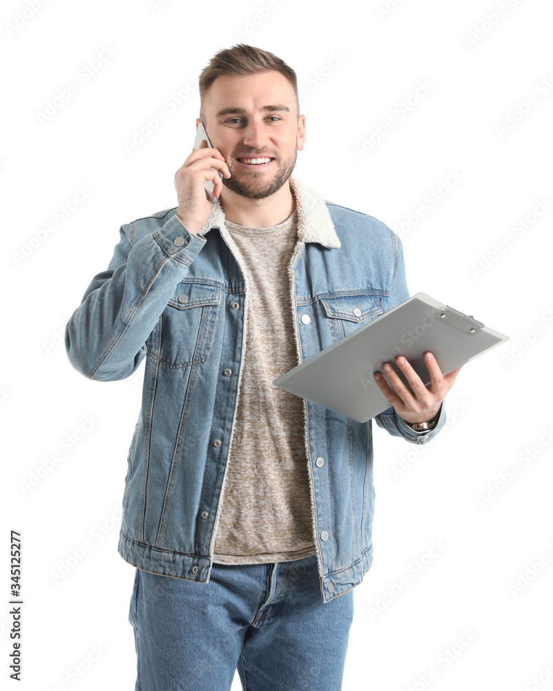 Young man talking by mobile phone on white background