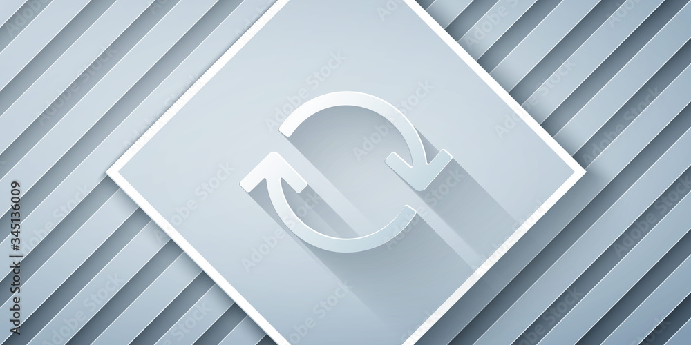 Paper cut Refresh icon isolated on grey background. Reload symbol. Rotation arrows in a circle sign.