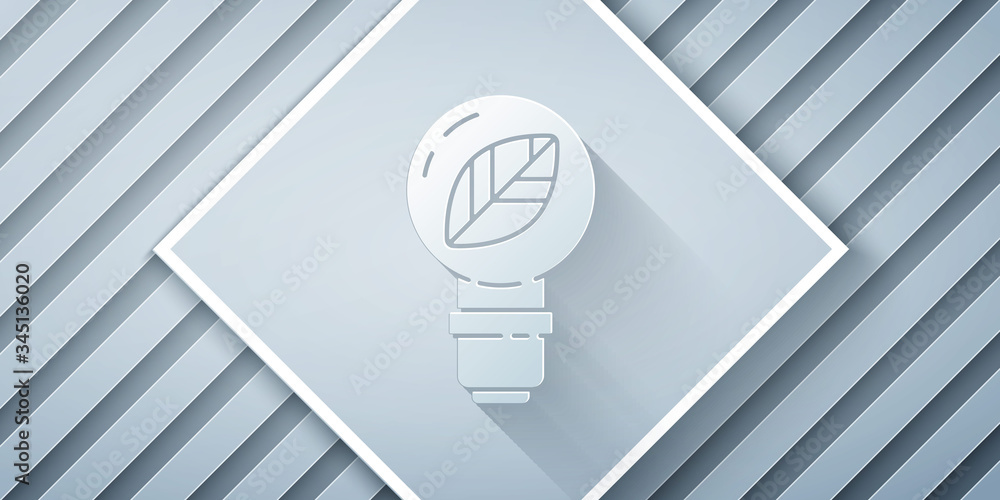 Paper cut Light bulb with leaf icon isolated on grey background. Eco energy concept. Alternative ene