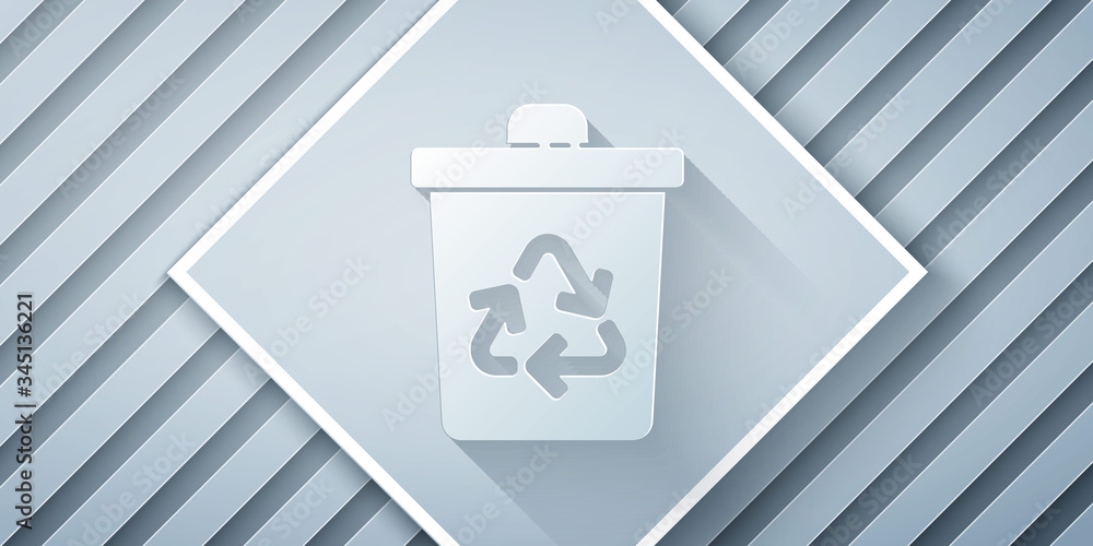 Paper cut Recycle bin with recycle symbol icon isolated on grey background. Trash can icon. Garbage 