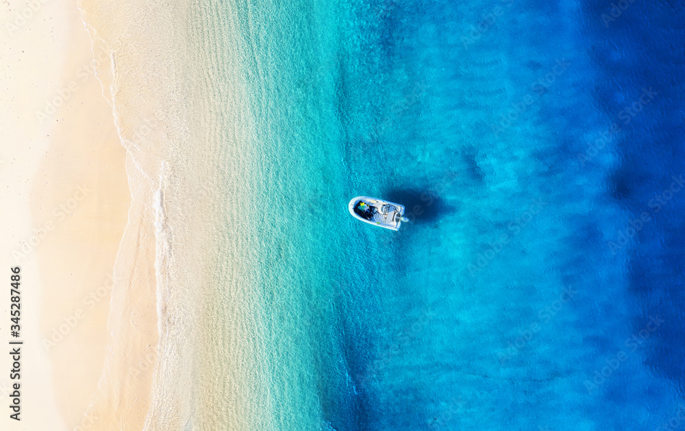 Boat and coast from top view. Turquoise water background from drone. Summer seascape from air. Trave