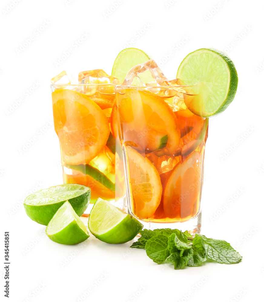 Glasses of tasty cold ice tea on white background