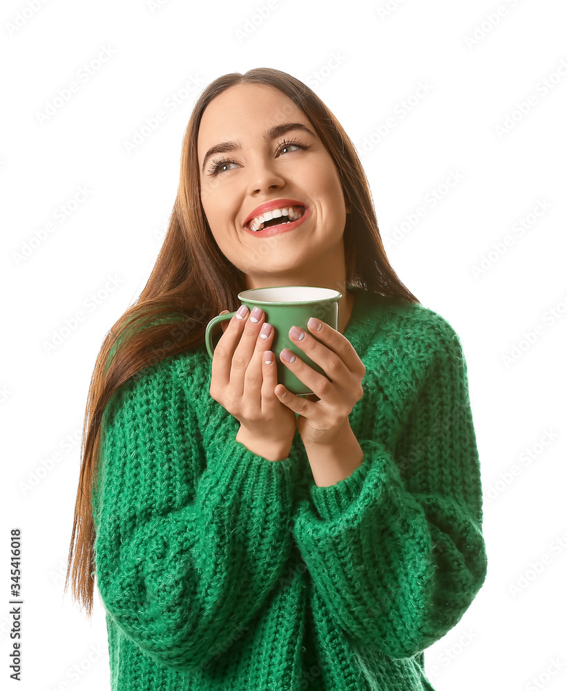 Beautiful young woman with cup of hot cocoa on white background