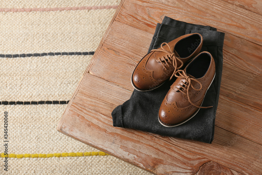 Stylish school uniform on wooden table