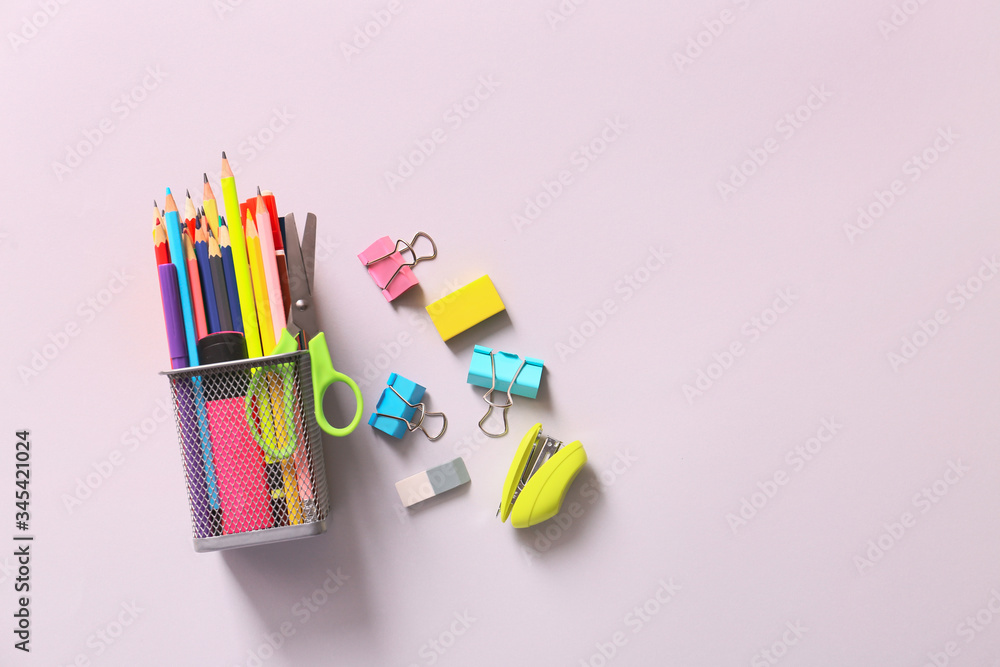 Holder with stationery on light background