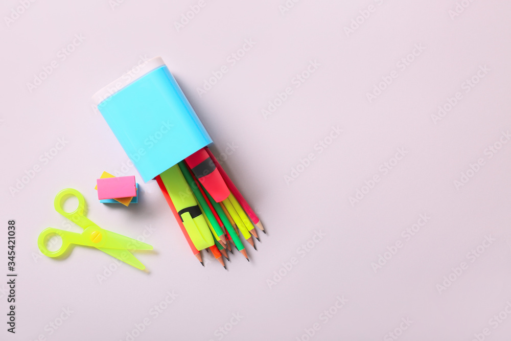 Holder with stationery on light background