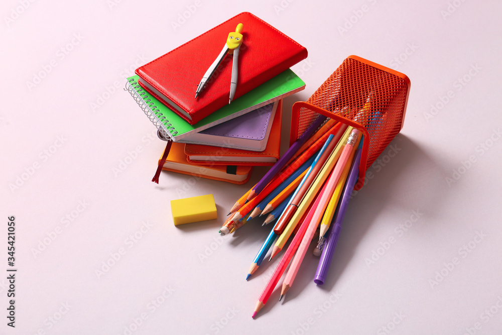 Holder with stationery on light background