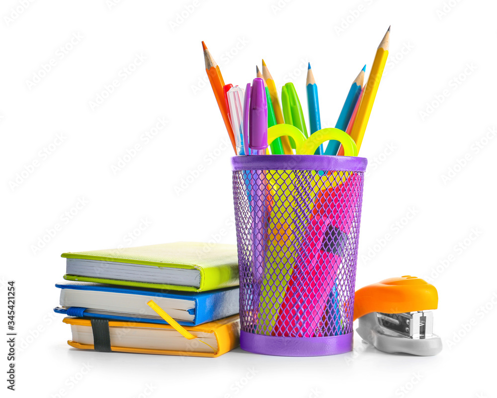 Holder with stationery on white background