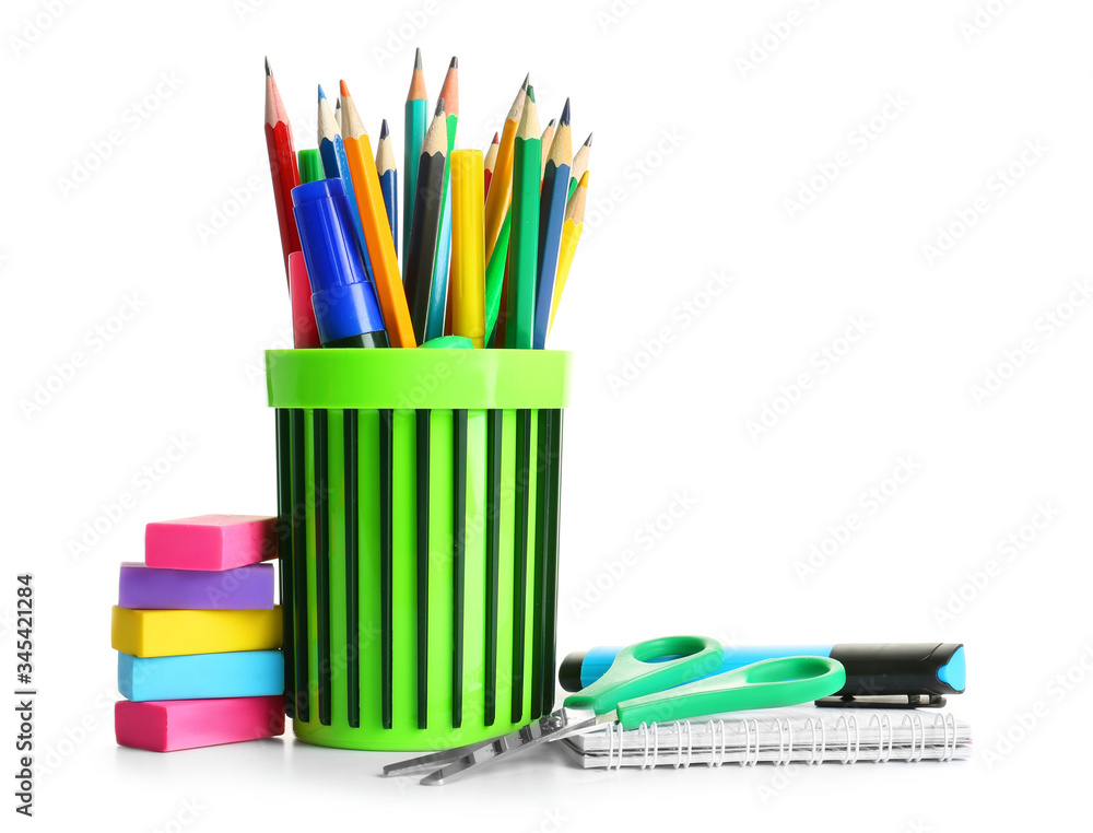 Holder with stationery on white background