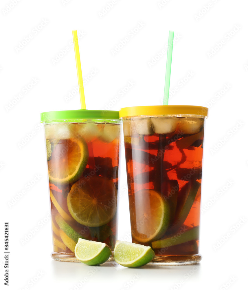 Glasses of tasty cold ice tea on white background