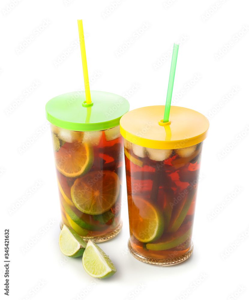 Glasses of tasty cold ice tea on white background