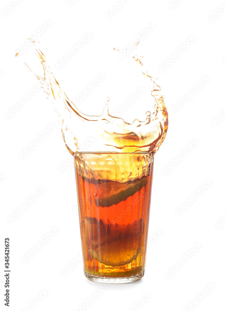 Glass of tasty cold ice tea with splash on white background