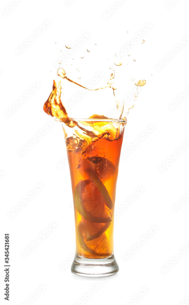 Glass of tasty cold ice tea with splash on white background