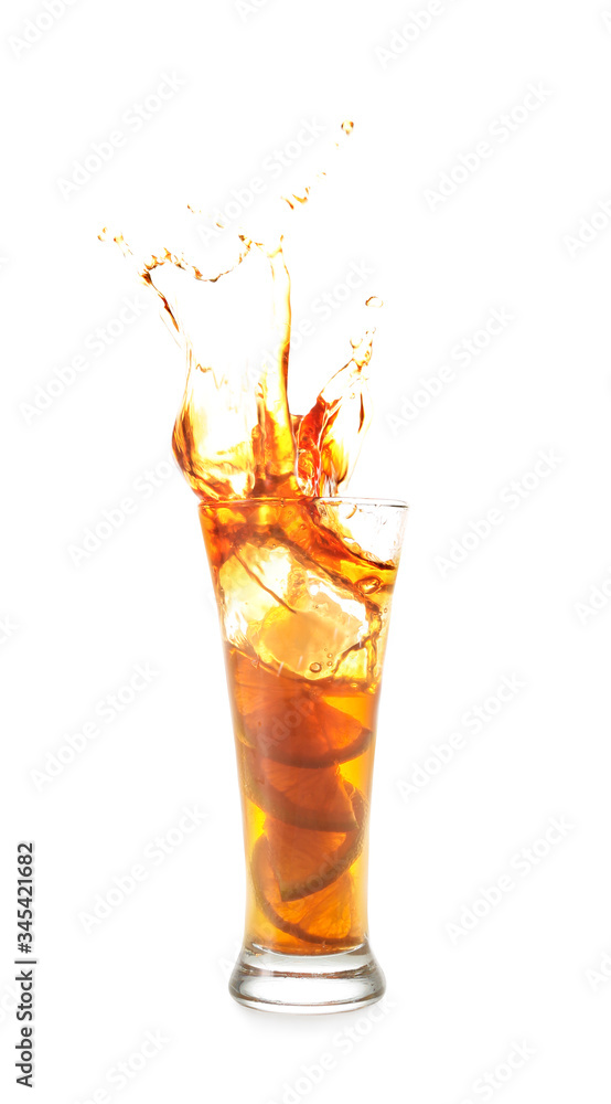 Glass of tasty cold ice tea with splash on white background