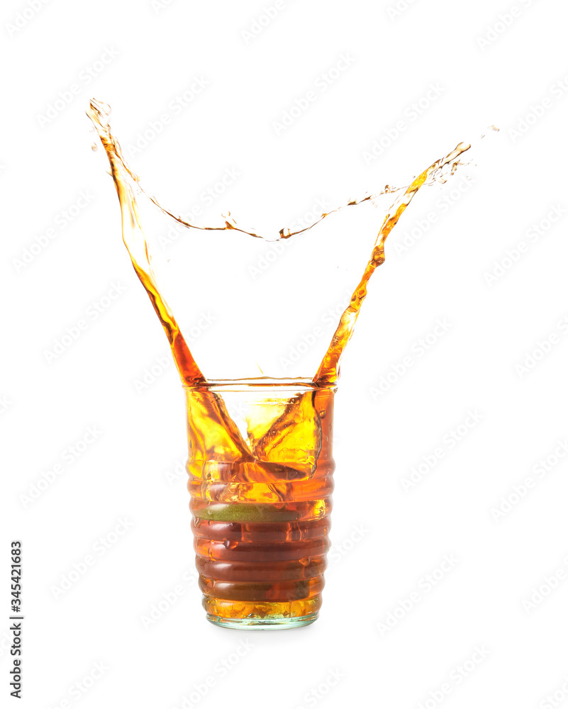 Glass of tasty cold ice tea with splash on white background