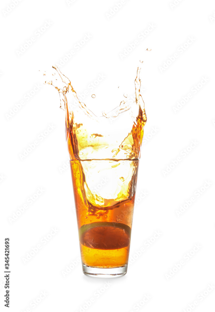 Glass of tasty cold ice tea with splash on white background